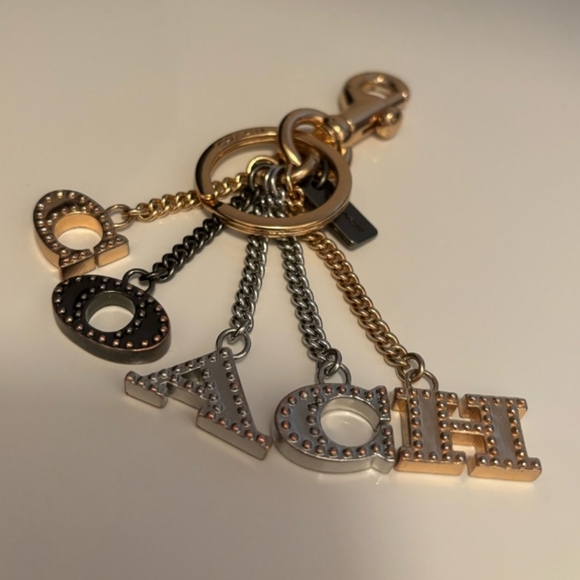 NWOT Coach Perforated Sparkle "COACH" Letters Gun Metal Bag Charm Keychain - Picture 7 of 7